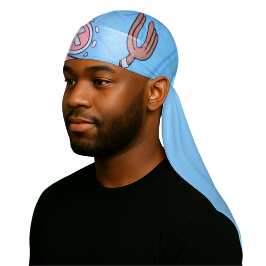 Man wearing Tony Chopper - Silky Crown Durag in blue with anime-themed design on head and tied at the back.